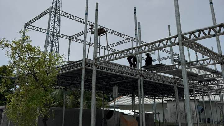 Crew working on roof trusses