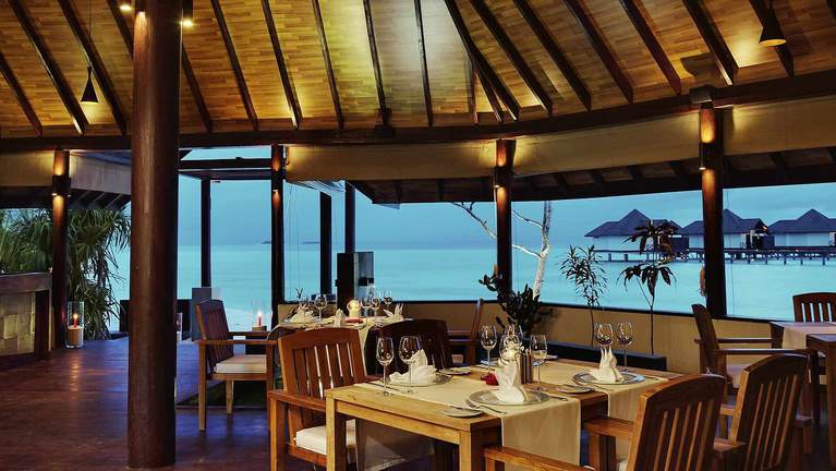 Robinson Club restaurant with timber floor and lagoon view