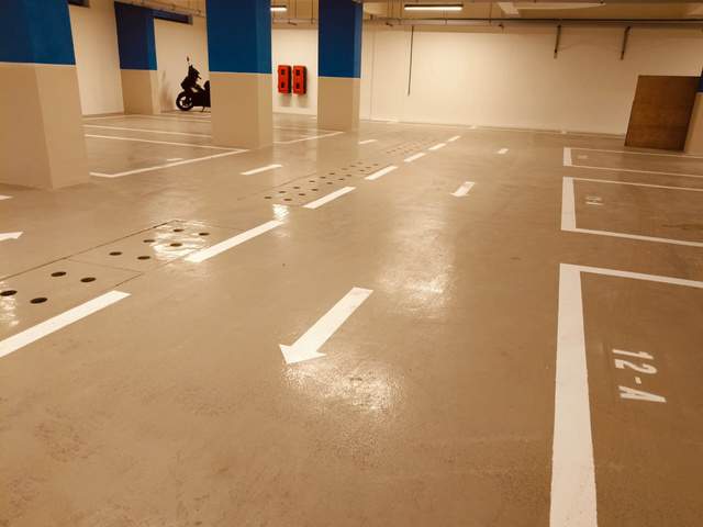 Finished car park with bay lines and directional arrows